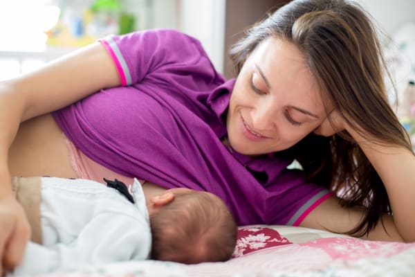 breast asymmetry after pregnancy due to breastfeeding Stock Photo